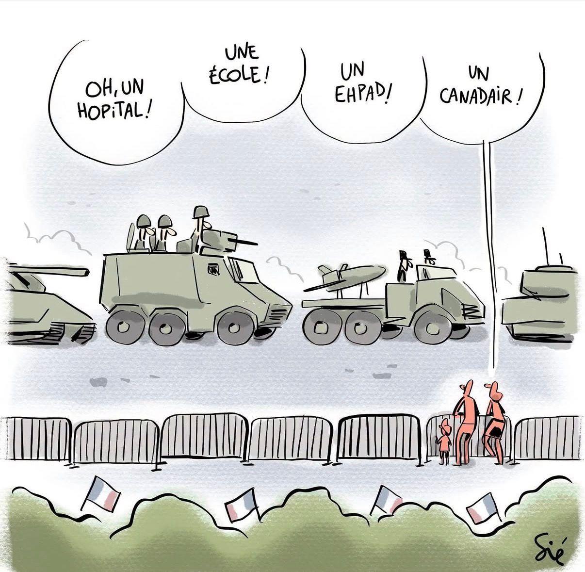 Une famille regarde passer les véhicules militaires lors du défilé ils disent : 
Oh un hôpital, ho une école, ho un EHPAD, ho un canadair